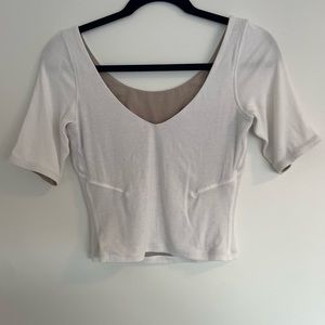 Lululemon white reversible ribbed elbow length top. Size 8.